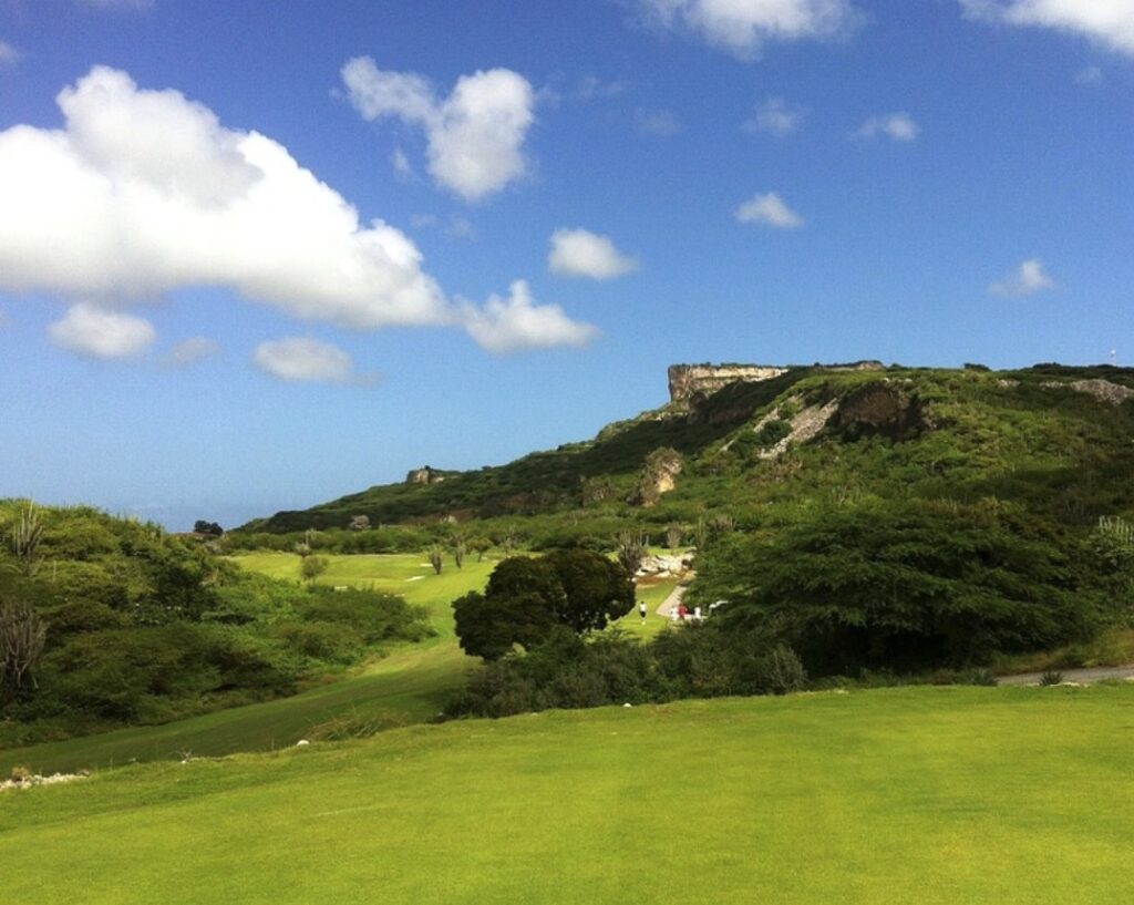 Golf on Curacao with Table Mountain in the background